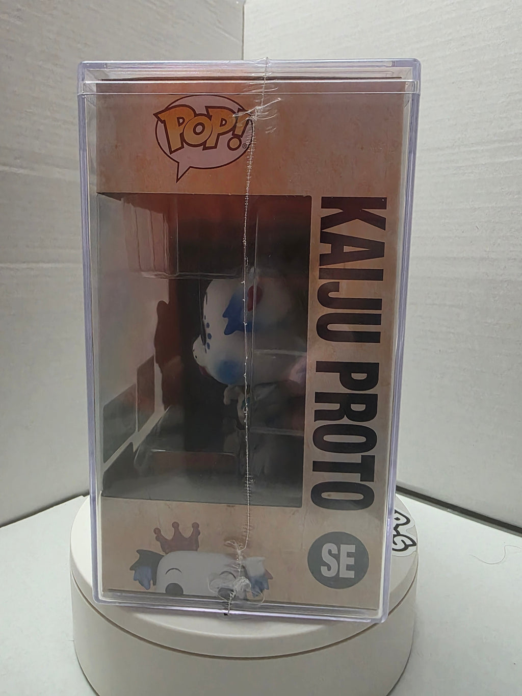 Funko Pop! Kaiju Proto top of acrylic hard case with Funko seal