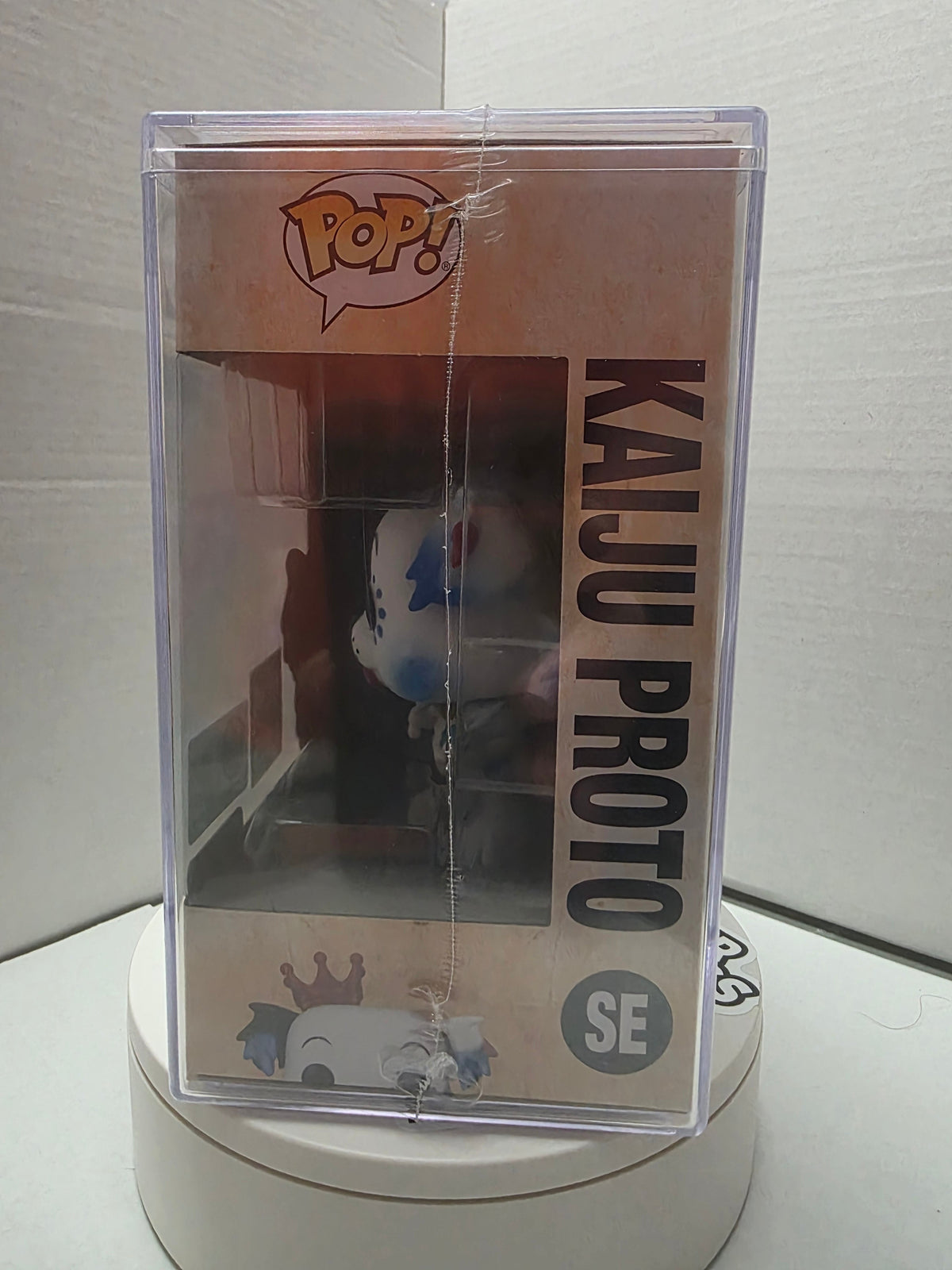Funko Pop! Kaiju Proto top of acrylic hard case with Funko seal