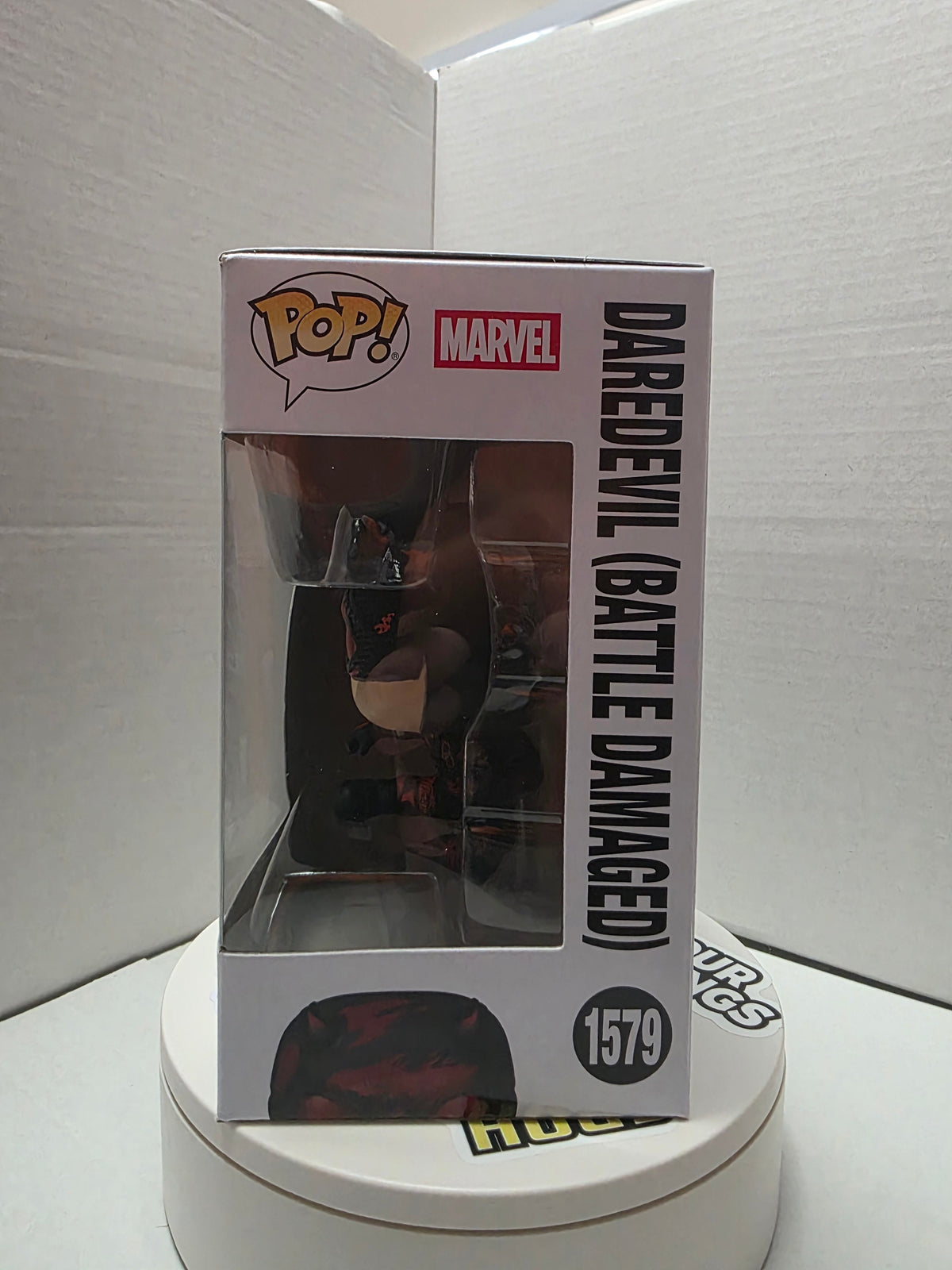 Funko Pop! Daredevil Battle Damaged #1579 left side showing figure through window