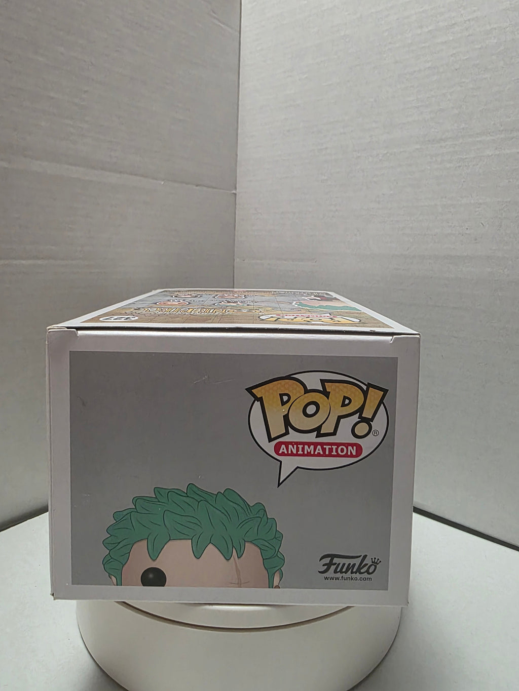 Funko Pop One Piece Roronoa Zoro 327 top of box showing wear