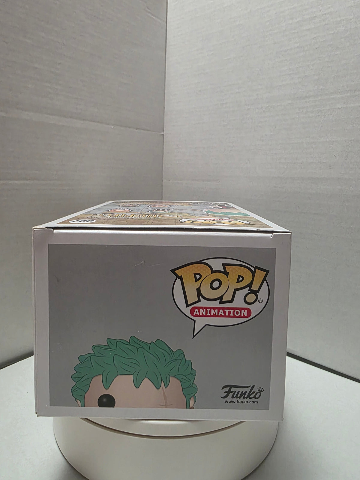 Funko Pop One Piece Roronoa Zoro 327 top of box showing wear