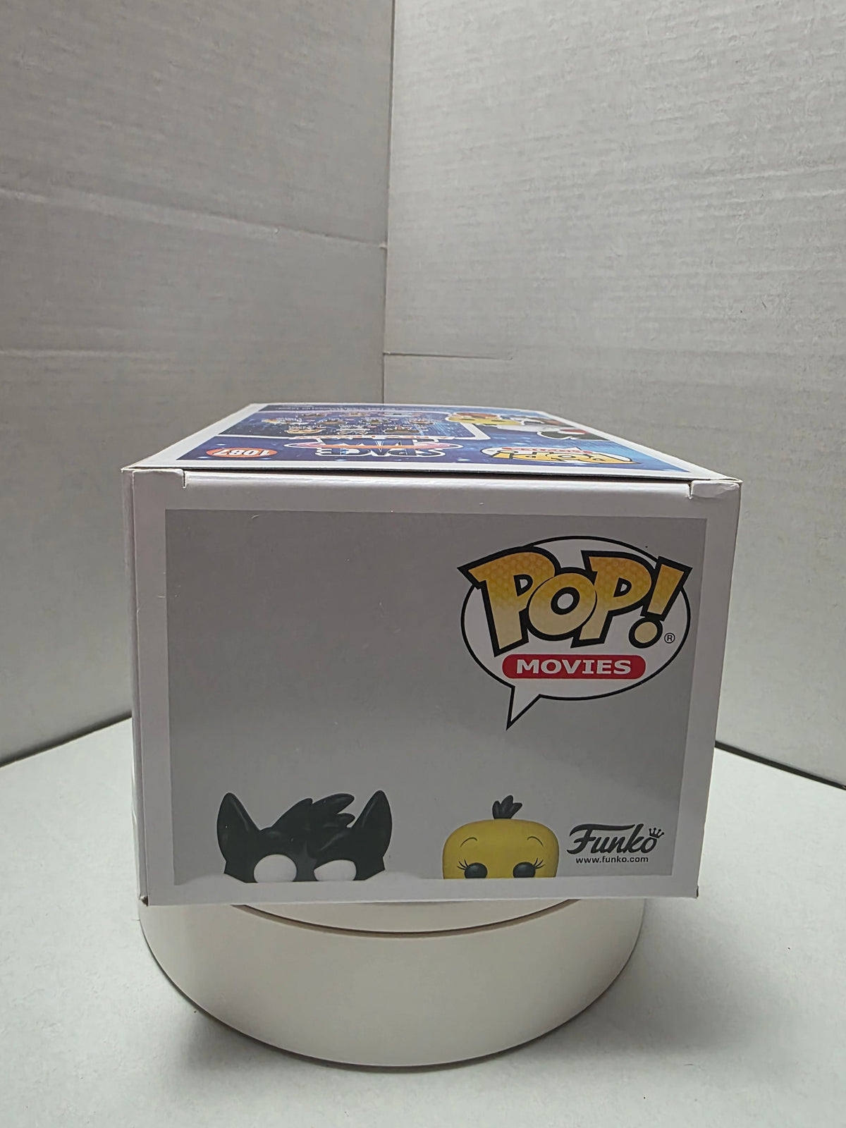 Funko Pop Sylvester & Tweety #1087 character art side panel showing Tune Squad uniforms